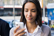 Person interacts with cell phone.